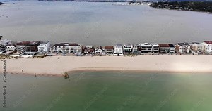 Sandbanks Beach in Dorset, UK With Beachfront Properties. Aerial Dolly Left