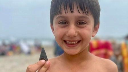 Fossilized great white shark tooth in Narragansett found by beachcombing brothers