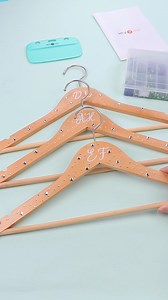 DIY Wooden Hangers for Wedding. Steps: 1. Transfer initial name decal to the front of the hanger. 2. Heat press HTVRONT Hotfix Rhinestones. Materials👉 https://amzn.to/44ouQ9K #htvront #weddingcrafts #diywedding #bridesmaidgift #diygift #Rhinestones #diyRhinestones #bridesmaidgiftideas #giftideas #diycrafts #cricut #cricutprojects #cricutcrafter #silhouettecameo #partygiftidea #weddingideas | HTVRONT