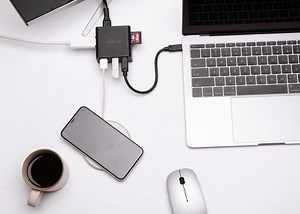 Nestling MacBook power adapter and USB-C hub