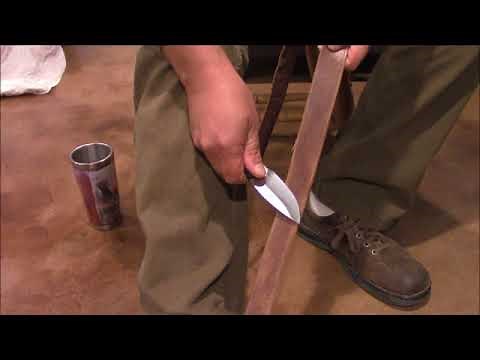 Sharpening a knife with a leather belt