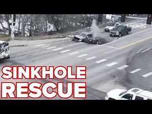 WATCH: 2 cars swallowed by sinkhole; bystanders jump into action to rescue
