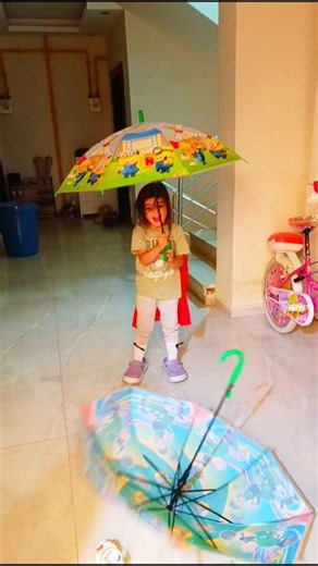 Walking down the hallway with an umbrella wearing giant slippers, get home quick Liza it’s late a...