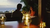 Couple enjoying romantic candle light dinner