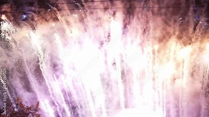 Real Fireworks Abstract blurred image of real glowing golden fireworks with bokeh lights in the night sky. Beautiful fireworks display, fireworks celebration