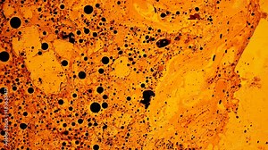 Ferromagnetic fluid creates amazing drawings in the yellow liquid,like oil substance