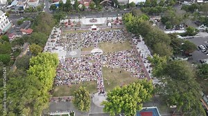 An aerial footage of Muslim congregation praying Eid in the field Stock Video