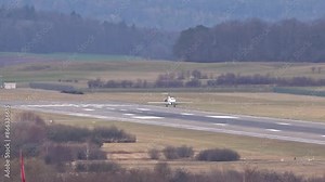 business jet landing at generic airport runway with touchdown soft arriving arrival
