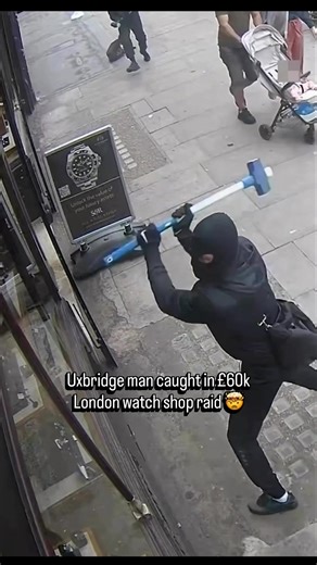 A 46-year-old man from Uxbridge was just convicted as part of a major gang that carried out this broad daylight smash-and-grab on Edgware Road. The shocking CCTV shows two men in balaclavas using sledgehammers to smash through the windows, grabbing nearly £60,000 worth of watches before escaping in a silver Jaguar. It turns out the local man was also on license for a murder committed back in 2005. Absolute madness. 🚨📉 (@metpolice_uk) #UB1UB2 #London #Uxbridge