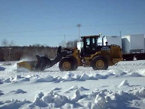 John deere 544k loader plowing