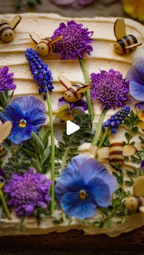 Must Love Herbs - Lauren May on Instagram: "Banana & Honey Cake with Brown Sugar Frosting and Marzipan Bees Tutorial 🐝 🍯 🍌 I decorated the cake with pansies from my garden as well as yarrow leaves, grapes hyacinths (yes, they are safe just don’t go eating a field of them), and pincushion flowers! 2 cups all purpose flour 1 1/4 cup sugar 3 1/2 teaspoons baking powder 1 teaspoon salt 3/4 cup smashed banana 1 cup milk 1/2 cup melted butter 1/4 cup honey Preheat oven to 350° F. Grease an 8x8 pan 