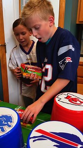 Touchdown Toss - Football party game 🏈 Family plays funny football party game with mini bean bags and plates for fun football themed prizes. Toss a bean bag to score a touchdown and win a prize. Whoever lands on the golden plate, wins a special prize. This video was produced by Benson Family, Network Media, and Benson Bros. | Aaron’s Family