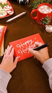 Take a cue from our lettering artists and add some festive flair to your holiday envelopes! ✍️🎄 Don't forget to add your final touches and send those cheerful cards on their way! 📬 #ChristmasCardDay | American Greetings