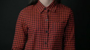 clip-25775573-woman-unbuttoning-shirt-showing-bra