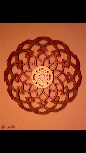 Deja Vu II: astonishing spring powered kinetic art. Crafted from wood this device has two disks, each with a pattern of curved spokes that can rotate at different rates and direction to produce interesting illusions of motion via moiré interference effects. A ribbon spring drives an ingenious mechanism that uses ratchets (and the rotational momentum of the disks) to create the various visual modes- a half rotation of the disks will result in 20 minutes of motion. With a full loading of the sprin