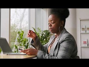 FREE Frustrated black woman sitting on a desk stock footage