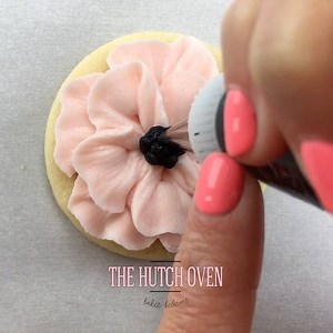 Pretty in pink buttercream anemone flower tutorial using @wiltoncakes tip 104 for the petals and tip 4 for the center. Music: Beautiful things courtesy of @audionetwork | Emily Hutchinson