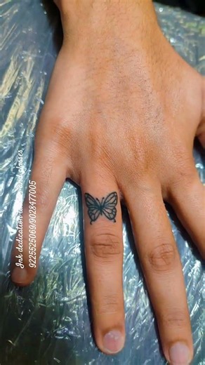 Tiny Butterfly, Big Meaning #ButterflyTattoo #FingerTattoo #FineLineTattoo #MiniTattoo #TattooArtist