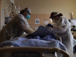 US COVID-19 deaths hit another one-day high at over 4,300