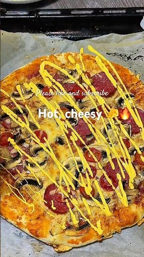 Homemade cheesy pizza with mushrooms and peppers.So melty