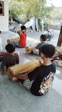 Mekendang (or makendang) is the activity of playing the traditional kendang (drum) instrument #art