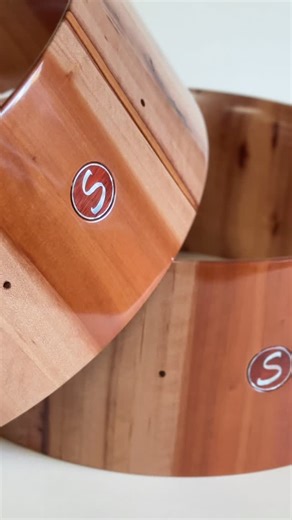 Our first ever Pacific Madrone snares, for sale tomorrow. I remember this wood throughout woodworking school making its way into many much of the furniture built there. A touch harder than Cherry, littered with stripe and color, smoother than a billiard ball. This wood is so beautiful and decadent. I’m happy to have finally built a pair of snares from it. We’ll be selling these 2 of 2 tomorrow at 8am. | Sugar Percussion