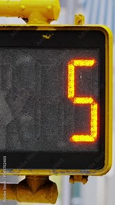 Urban scene, detail of traffic signalization in New York City, traffic light with countdown timer, vertical video