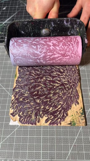 Orest Luzeckyj on Instagram: "Experimenting with different ink roll techniques! Featuring the Hidden Face Monster Woodcut! 👹 The monster just looks like a chaotic blob at first but it actually has two small eyes, a mouth, and some feet! Printed with a Pink / Purple rainbow roll! I am simply rolling the brayer onto a sheet of paper! I am also experimenting with reverse printing where I print the block onto the brayer itself and then roll the image onto paper! This creates different effects with 