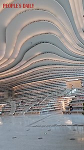 8.7K views · 385 reactions | Step inside Tianjin Binhai Library ✨—beyond its futuristic design, it’s a quiet place to rest, read, and wander through endless stories. #Tianjin #LibraryGoals #ChinaArchitecture #Reading | Embassy of The People's Republic of China in the United States | Facebook