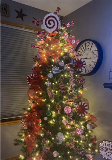 Decorated before Thanksgiving and I regret NOTHING. My tree looks like she walked straight out of Candy Land — tree full of red   white lollipops and striped ribbon, can you blame me? #christmasdecor #christmastree #christmas #decor #fyppppppppppppppppppppppp