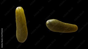 Cyclic rotation of two types of cucumbers around their axis. Looping motion. Close-up. Alpha Channel.