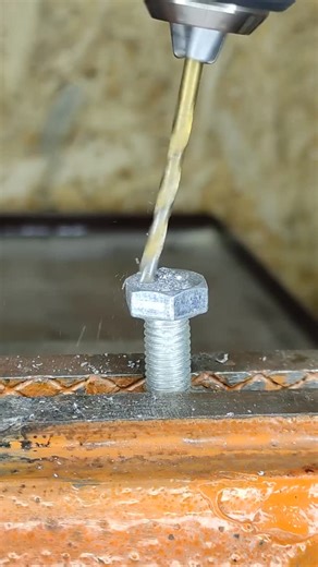 DIY Tool Hacks on Instagram: "Efficient wire twisting is a common requirement in many projects. This technique provides a straightforward solution for achieving consistent results. The method utilizes a simple bolt and a power drill to automate the process. Start by drilling two holes through the head of a bolt; ensure these holes are appropriately sized for the wires you will be twisting. Next, prepare your wires by stripping the insulation from their ends and thread them through the drilled ho