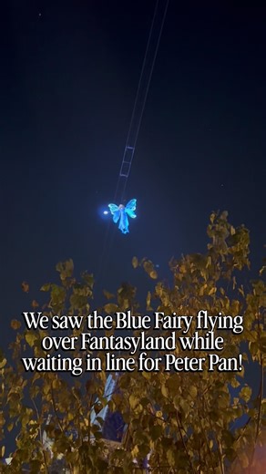 The Blue Fairy flying through the air at Disneyland from the Peter Pan line during Wondrous Journeys