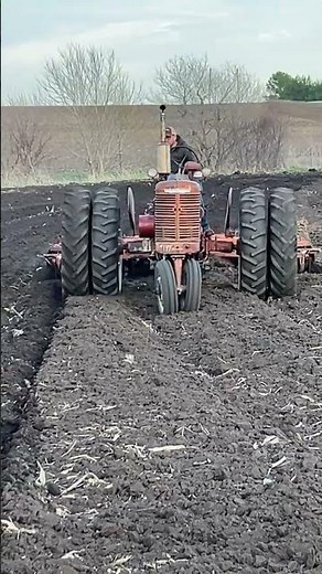 Farmall MD disking plowed ground.