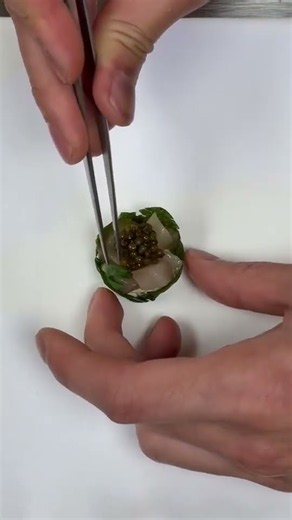 A delicate mackerel canapé- Caviar, cucumber, buttermilk, potato and tart - Number One by John Munro