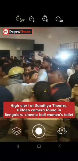 A hidden camera was found inside the women’s toilet of a cinema theatre in Bengaluru, triggering panic and outrage among moviegoers. The incident took place at Sandhya Theatre, which comes under the Madiwala police station limits. The camera was noticed when women stepped out to use the washroom during a screening of the re-released Telugu film Nuvvu Naaku Nachav. On spotting the device, they alerted others in the theatre. Local people quickly caught a youth suspected of placing the camera and h