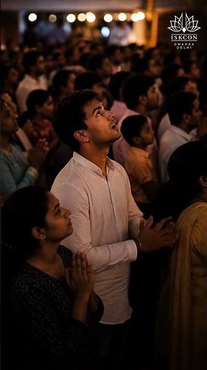 At ISKCON Dwarka devotees are deeply immersed in prayer, chanting
