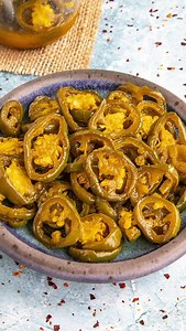 This homemade cowboy candy recipe, or candied jalapenos, is so easy, perfect for desserts or snacking, nice and sweet with a touch of heat. They're a great blend of sweet and heat. Basically sliced jalapenos preserved in a seasoned simple syrup, they're perfect for garnishing cocktails, topping corn bread or cupcakes, or popping into your guacamole. >> Comment “RECIPE" and I'll send this recipe straight to your DMs! 🥳 RECIPE: https://www.chilipeppermadness.com/chili-pepper-recipes/desserts/swee