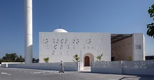 reinterpreted islamic patterns and triangulated geometry clad mosque in UAE