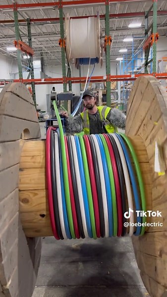 Sasquatch making this 5 conductor parallel pull look easy 💪😂 Follow us for more behind-the-scenes videos, and check out the “shop” link in our bio to shop all of our wire and cable-cutting products ⚡ #pullingwire #wirepulling #wireservices #wirereel #sparky #sparkylife #hardhatlife #electrician #construction #warehouse #warehousejob