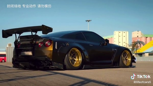 High-Speed Car Showdown: GTR35 vs. White Hatchback