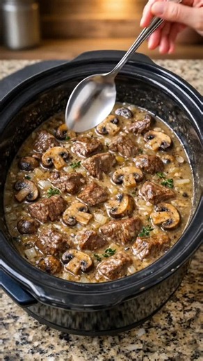 Recipe Name: Slow Cooker Creamy Mushroom Beef Tips Ingredients 1. 2 lbs beef stew meat 2. 8 oz mushrooms, sliced 3. 1 medium onion, diced 4. 3 cloves garlic, minced 5. 2 cups beef broth 6. 1 can cream of mushroom soup 7. 1 tbsp Worcestershire sauce 8. 1 tsp dried thyme 9. 1 tsp salt 10. 1/2 tsp black pepper 11. 2 tbsp cornstarch 12. 2 tbsp water 13. Fresh parsley for garnish Recipe 1. Place beef, mushrooms, onion, and garlic into the slow cooker. 2. In a bowl, whisk together broth, soup, Worcest