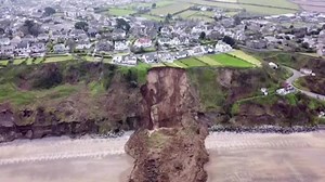 Drone view of homes after Welsh cliff collapse