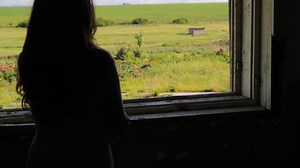 Oppressed Woman looking at Freedom out of Dark Room Women's Rights Concept HD