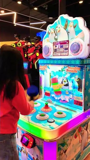 Playing the Naughty Penguin Hammer Arcade Game