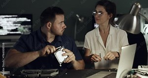 Hardware, laptop or people with repair equipment, electronics or maintenance service in tech lab, garage or workshop. Information technology, night or man borrow computer fixing tools to team partner