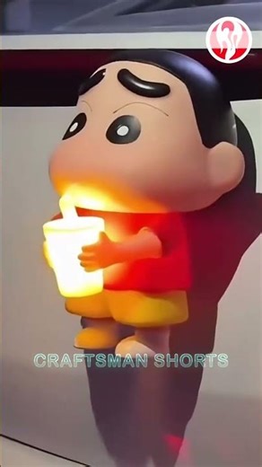 Doll | Light-up doll attached to the back of a Cadillac