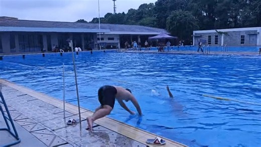 Hilarious pool rescue fail: Lifeguard slips and falls in!
