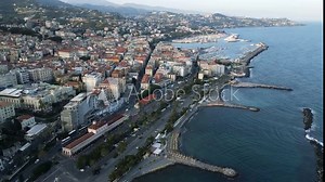 Sanremo Italy coastal promenade and harbor with classical architecture, aerial establishing dolly
