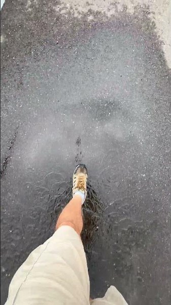 Stomping in a Water Puddle with Shoes on a Rainy Day